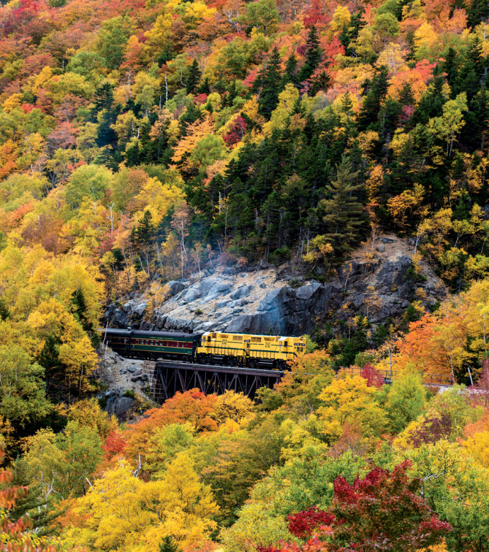 Conway Scenic Railroad’s Notch Train rolls through prime White Mountain foliage.