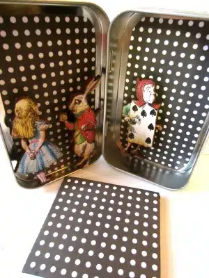 Altered Tin Interior with Magnets Made from Wood Cuts