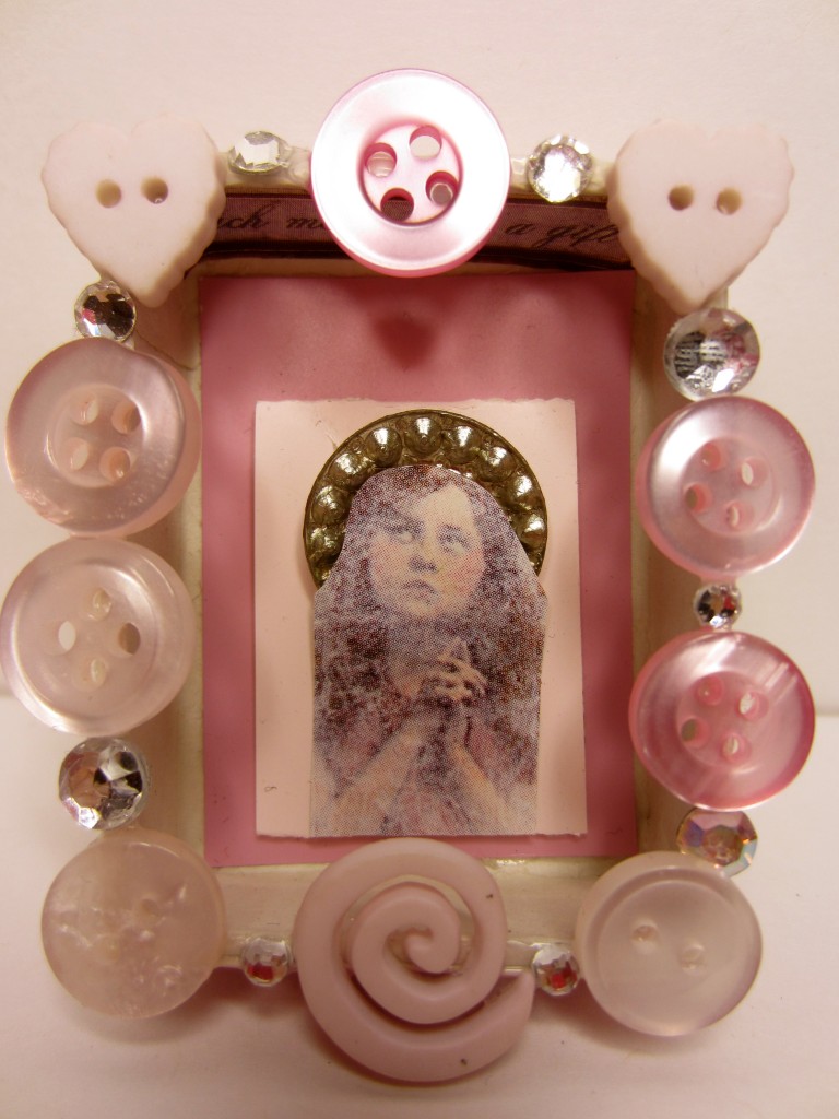 Buttons, beads, and paper were used to create this tiny diorama.