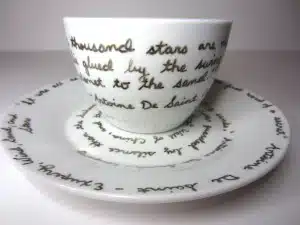 Favorite quotes written on a plate and tea cup with porcelain pen