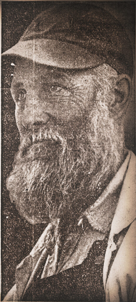 Sepia-toned portrait of an older man with a beard, wearing a cap and collared shirt, looking to the side.