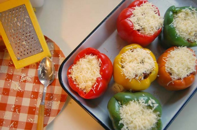 Top each pepper with shredded cheddar, pepper jack, or mozzarella cheese and bake!