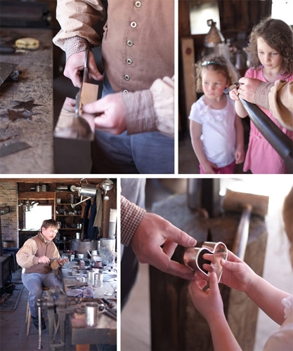 Tinner Richard Eckert works with Ella and Lucy to make tin heart shaped cookie cutters the Tin Shop originally from Sturbridge circa 1800-1850 and reconstructed in 1985.