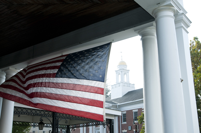 An american flag catches the breeze opposite the town hall in Lenox.