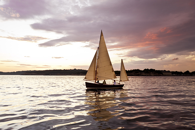 The wind has nearly died as the sun makes her closing remarks and sailors head for shore.