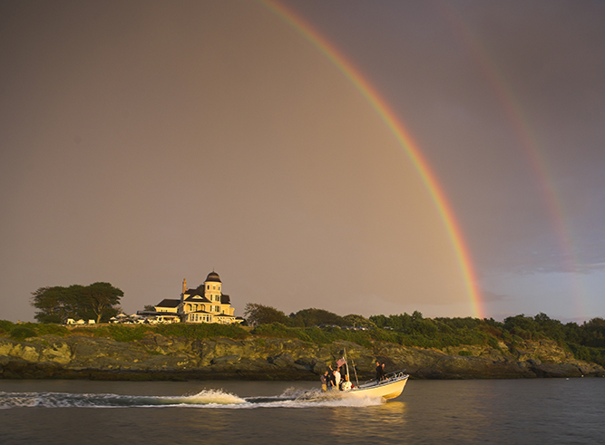 A perfect rainbow poses over Castle Hill Inn.