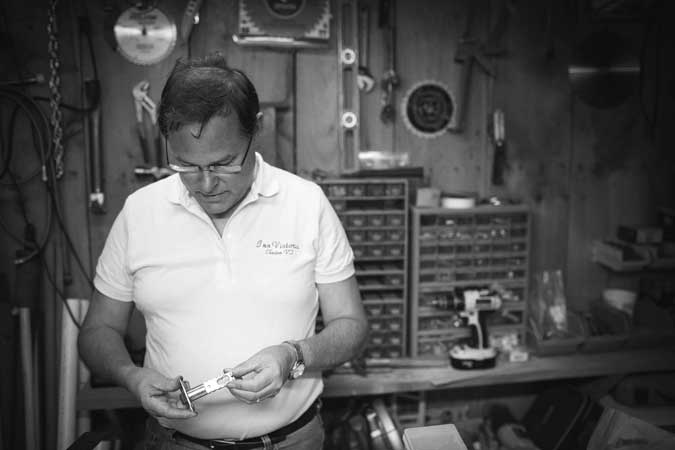 3:30 p.m. Dan fixes a lock in his basement workshop