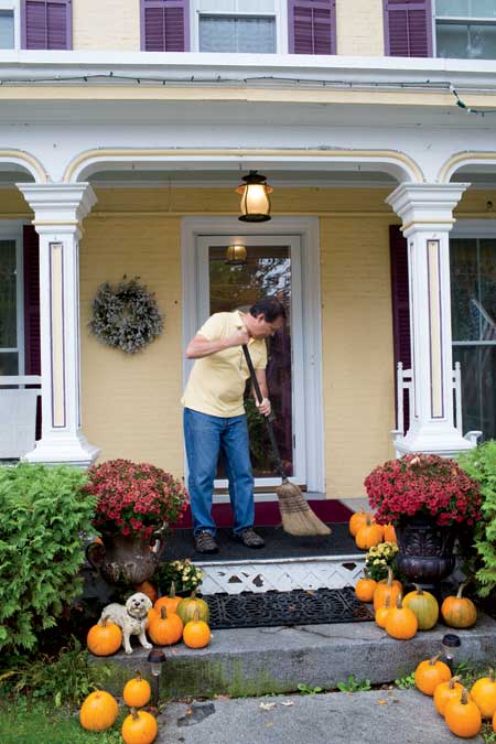 1:30 p.m. Dan sweeps the inn’s front porch. 