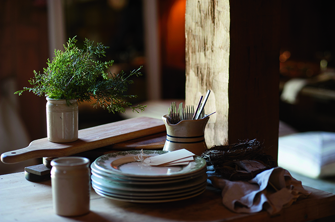 Plates, placecards, and delicate herbs are ready for the feast. 