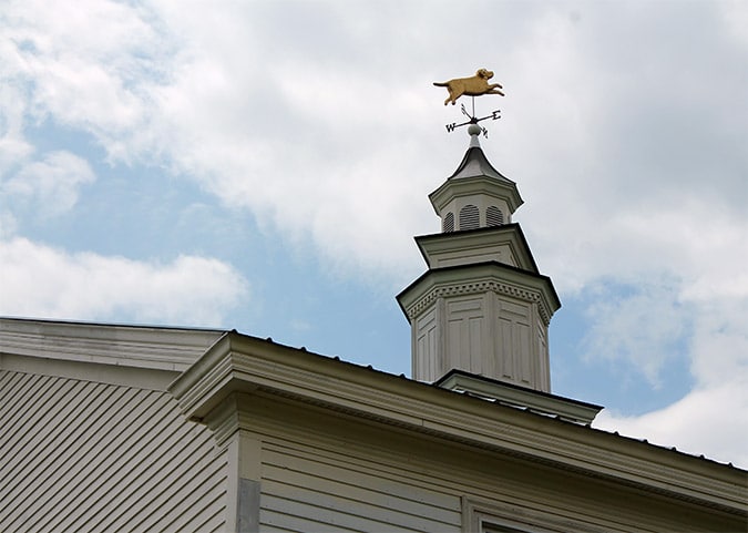 A figure of a dog adorns the steeple on Dog Chapel.