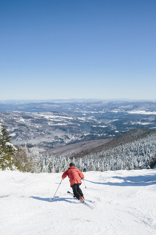 A skier takes in the expansive views at Mad River Glen.