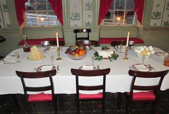 The dining table is set in the parlor of the Salem Towne House.