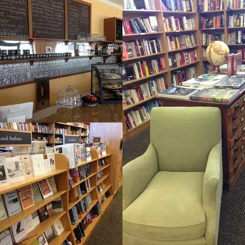 A cozy bookstore cafe with shelves of books, a brown display cabinet topped with a globe, an olive green armchair, and a counter with stacked glasses and a dessert display.