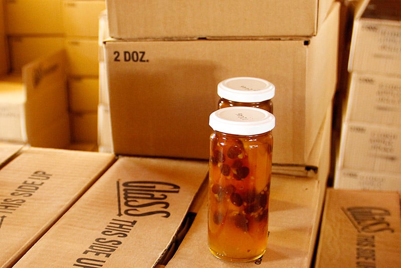 Jars of jelly and chutney are boxed and shipped from the back of R.E. Kimballs.