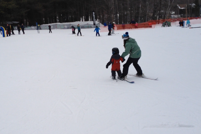 Student and teacher taking their time on the bunny slope. 