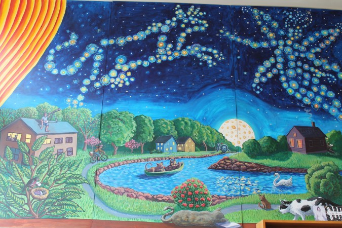 Tara Goreau's bookstore mural aptly includes the cow jumping over the moon.