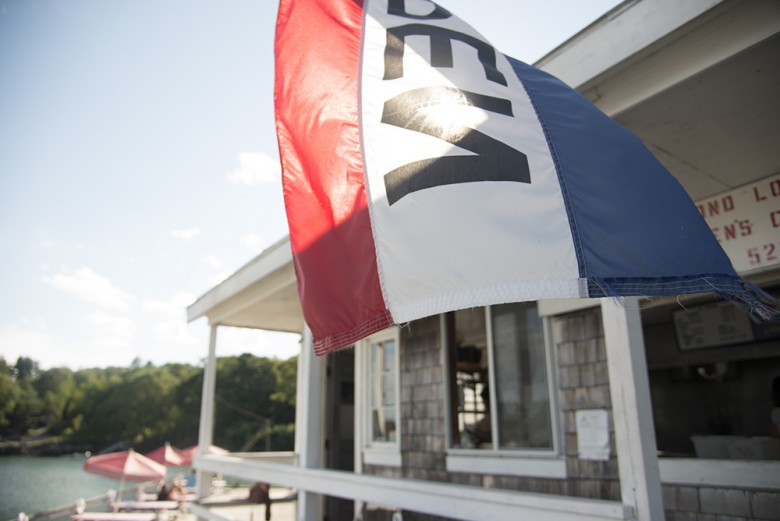 Round Pond Lobster Co. beckons customers to dine waterside on a perfect summer blue sky day.