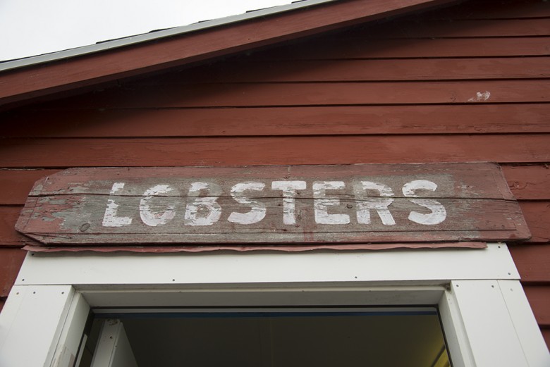 Weathered lobster sign at Five Islands.