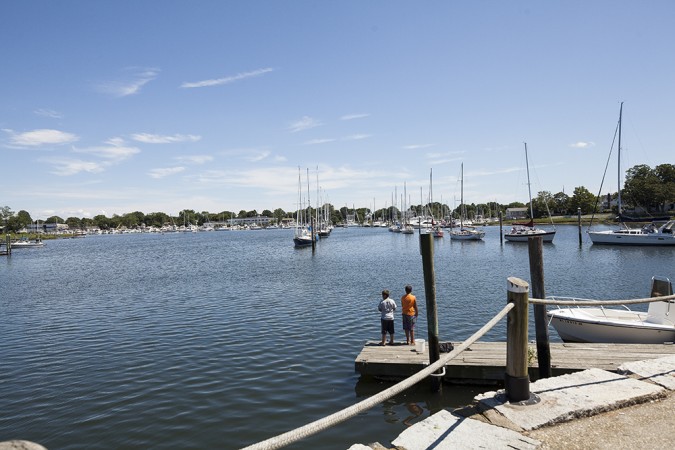Two boys try their hand at fishing from the dock in Wickford Harbor.