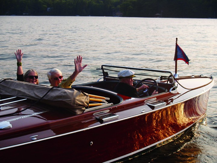 Chauffeured in the beautifully restored wooden Chris Craft owned by island neighbor and friend Ron Konig (at the wheel), Judson and Sally are off to a favorite lakeside restaurant for their 50th wedding anniversary dinner, September 6, 2008. Family members followed in another boat for a festive evening.