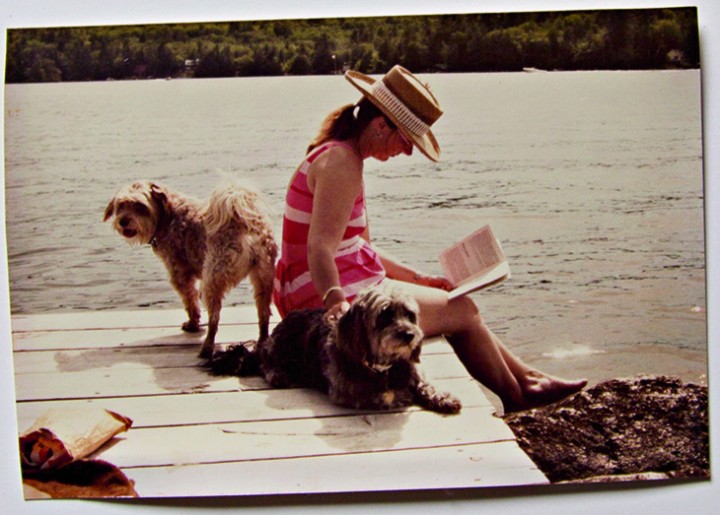 Suki (left) and Bunkie were invariably at Sally’s side on warm summer days “down on the dock.” This photo dates back to about 1979.