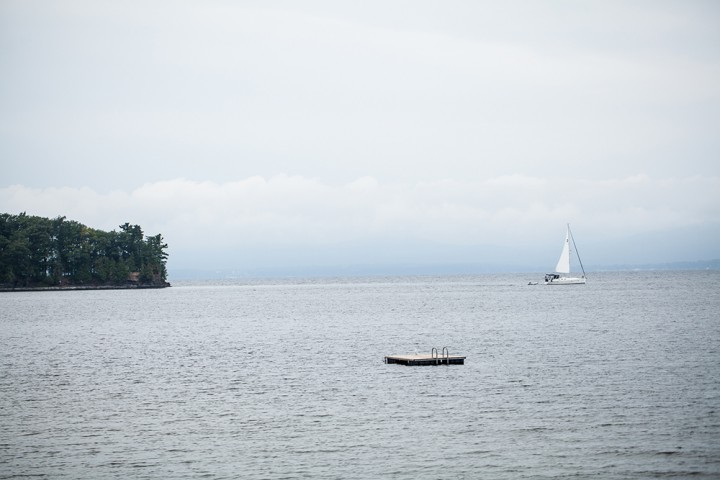 A classic, quiet scene looking out from shore at Lake Champlain.
