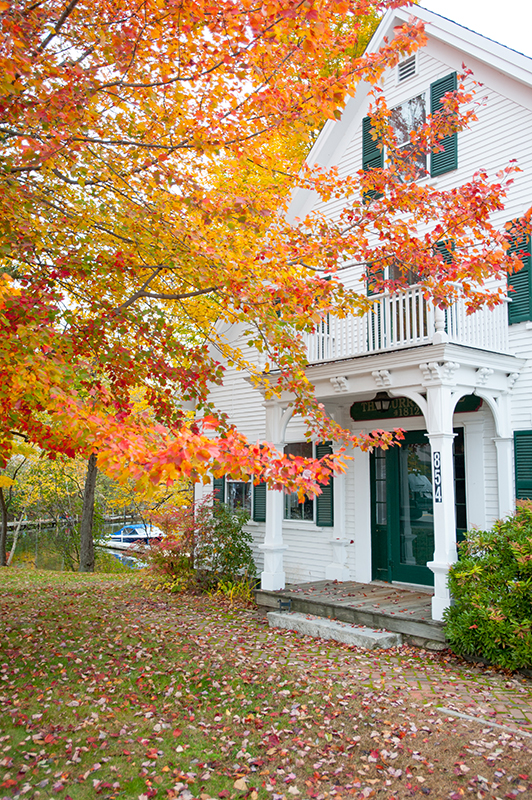 Home surrounded by autumn color in Holderness, NH.
