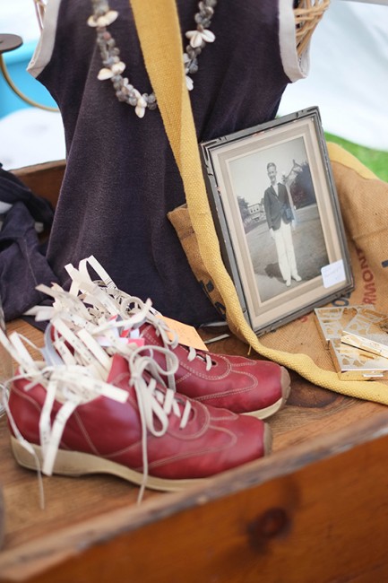 Vintage photo and red sneakers displayed at Cozy Nook's booth.