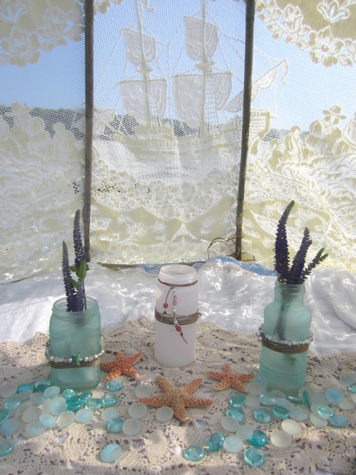 Sea glass bottles are a beautiful addition to beach picnics.