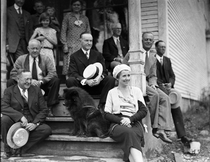 President and Mrs. Coolidge and their dog Blackberry in front of the general store, Plymouth, Vermont, 1931.