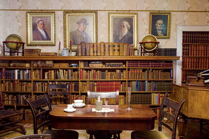 In the library, portraits by Rachael Robinson Elmer (Rowland and Ann Robinson’s daughter) depict, left to right, Rachel Byrd Stevens, Ann’s mother; Dr. Willard, a local physician; and Rowland Robinson. At far right is a portrait of William Robinson, Rowland’s great-uncle, by Ann Robinson.