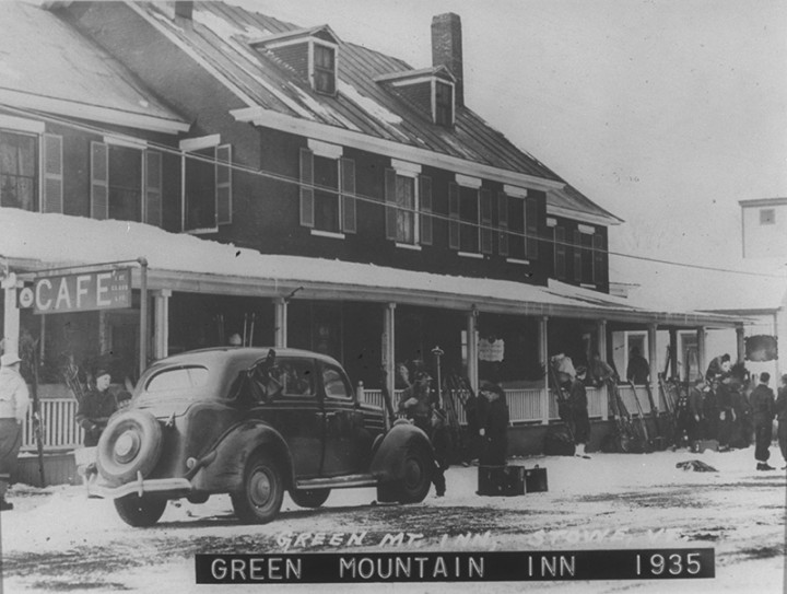 A classic packard sedan in front of the Green Mountain Inn circa 1935.