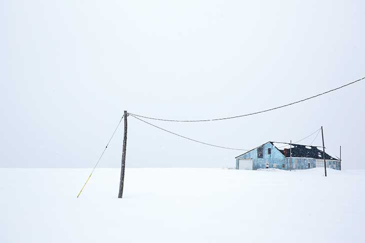 In Maine’s far northeast corner, a farm outbuilding stands in stark relief against snow-covered fields. “The weather was frigid, but there was a perfect serenity to the landscape,” notes photographer Joel Laino.“With few people in the area, I experienced a feeling of connecting with nature.”