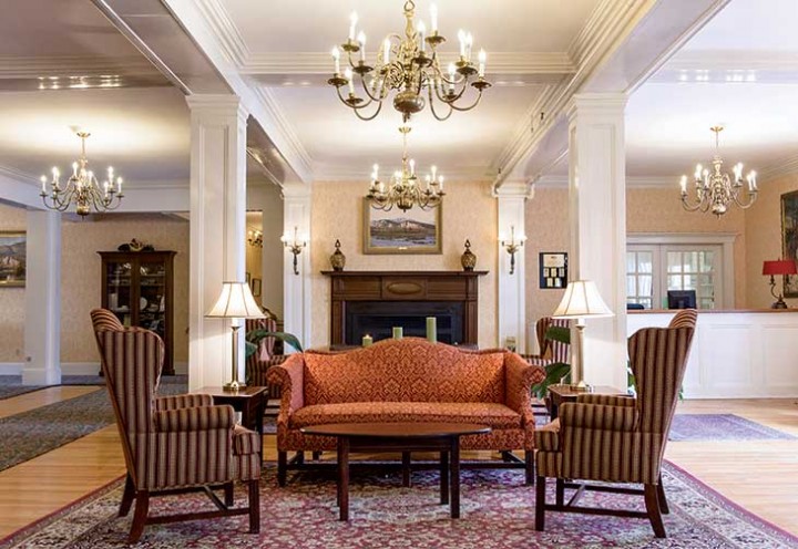 The grand lobby of North Conway’s Eastern Slope Inn, in Mount Washington Valley ski country, built in 1926 (as the Randall House hotel) in the elegant Colonial Revival style.
