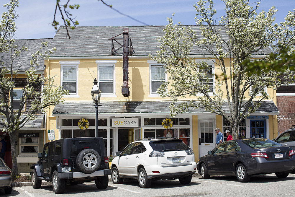 A building (find business name) in downtown Bristol has a sunny yellow exterior.