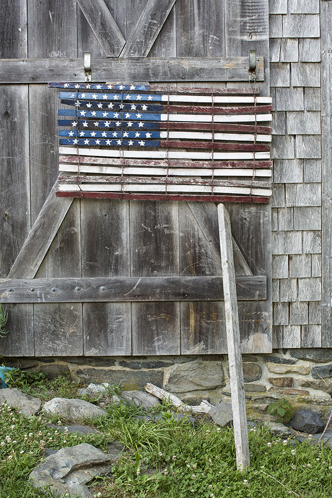 A wooden American flag adorns the barn at Watson Farm.