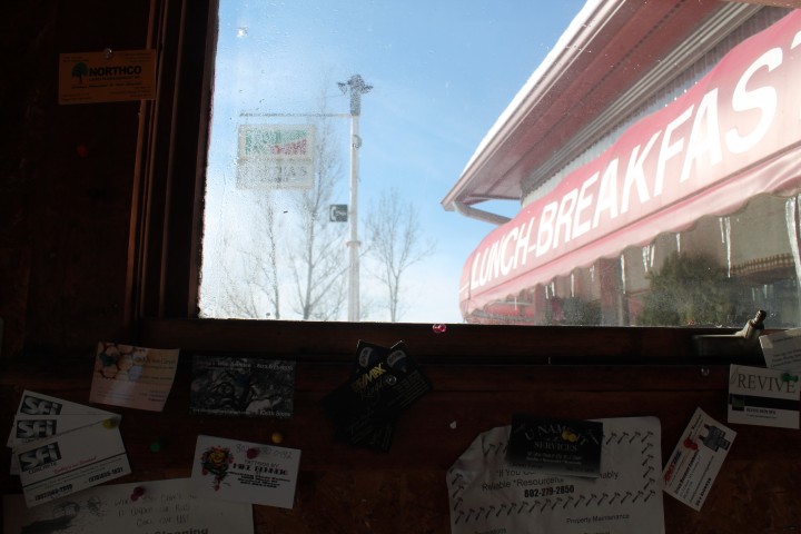 coming inside the diner, past all business cards and flyers 
