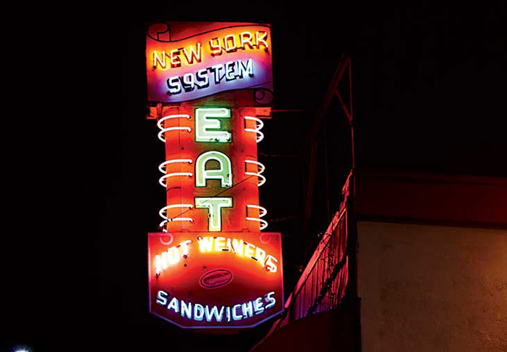 Colorful neon beckons diners.