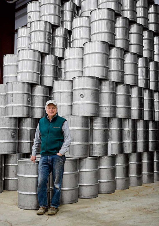 Maple packager and distributor David Marvin of Butternut Mountain Farm at his warehouse; bulk syrup is stored in steel barrels.