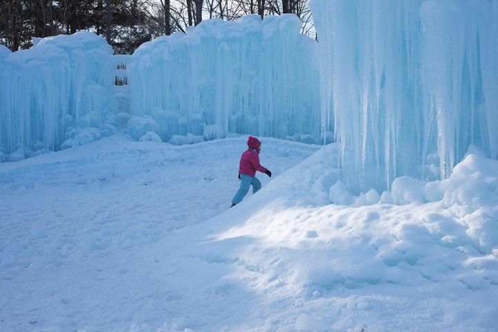 A young child stomps through the ice covered floors of the castle. 