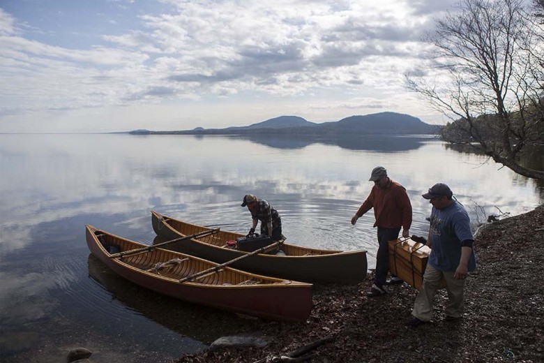 A few of the crew members load their canoes on Hardscrabble Point, located on the north side of Mt. Kineo and home to the group’s first camping site. 