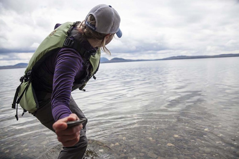 Maine Guide Lani LaCasce skips a stone along Moosehead’s calm waters during a snack break. 