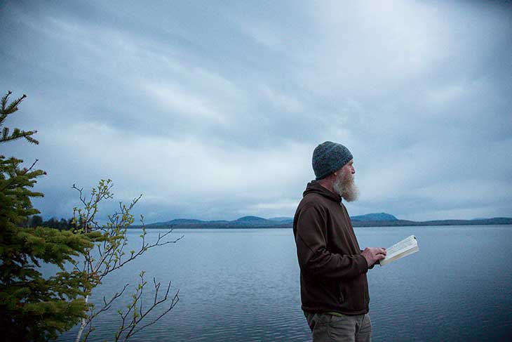Camp was a time, too, for reading, writing, and reflection. Here, Stan Tag reads The Maine Woods on a bluff at Seboomook Point, overlooking Moosehead’s northern end. Tag, a literature professor and a scholar of the 19th-century Maine North Woods, was one of the Thoreauic 8—the only scholar to go start to finish. When he returned home to Washington State, he dreamed “of moving through water. In my dream I am coming down the river into Indian Island.”