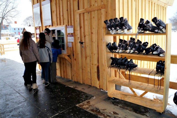 Ice skate rentals are kept in the pavilion next to the entrance to get on to the ice. The floor is rubber which makes for a safe surface to walk in while wearing the skates. 