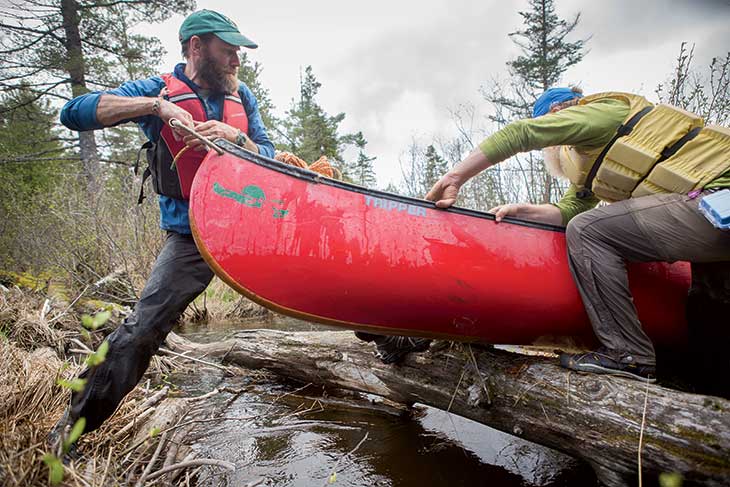 Forest entanglements made canoe carries a cooperative necessity. The wood-and-canvas canoes had been swapped for the more rugged Old Town Trippers. In 1857 Joe Polis would have mostly been on his own, emptying the canoe and lifting it over obstacles.