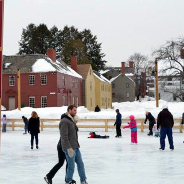 How are outdoor ice skating rinks kept frozen in warmer climates?