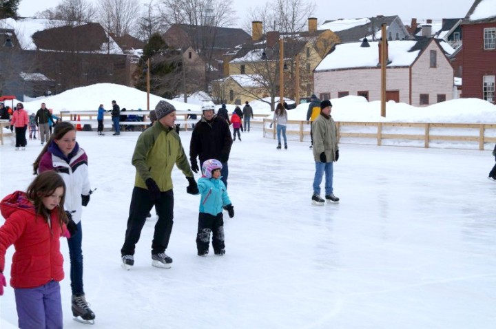 Families, couples and friends of all ages bundle up to enjoy a day of ice skating in the middle of a place rich with history. 
