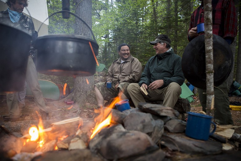 James Francis (right) and Jason Pardilla share a laugh by the campfire at the end of the day. 