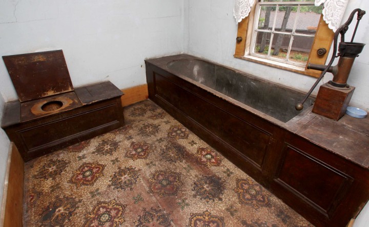 The home’s original indoor “outhouse” features the old tin tub at right, in which generations of Bartletts once bathed.