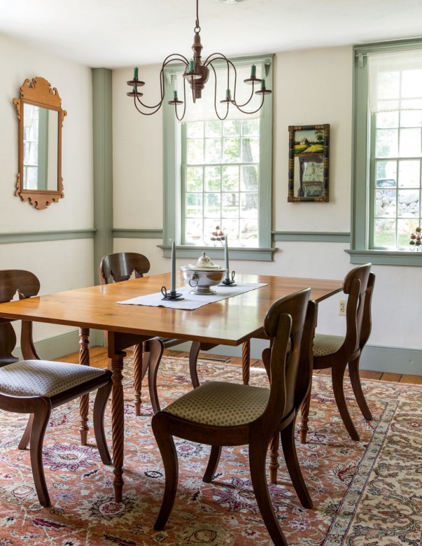 The Mackeowns’ dining room, which features the work of one local carpenter, who meticulously rebuilt most of the home’s window sashes.